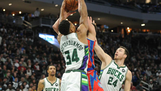 Nov 24, 2021; Milwaukee, Wisconsin, USA; Milwaukee Bucks forward Giannis Antetokounmpo (34) blocks the shot of Detroit Pistons center Luka Garza (55) in the first half at Fiserv Forum. Mandatory Credit: Michael McLoone-USA TODAY Sports